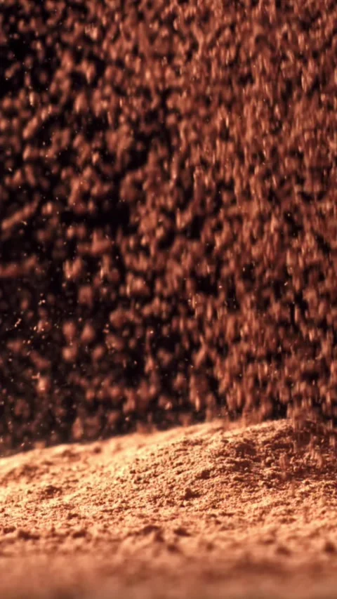 Cocoa powder falls on the table. Filmed on a high-speed camera at 1000 fps Stock Footage 335374704