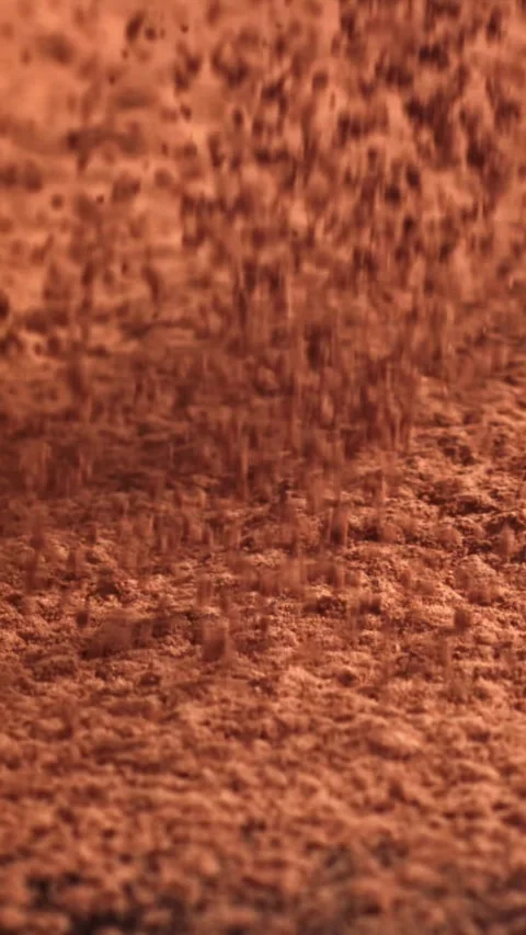 Cocoa powder falls on the table. Filmed on a high-speed camera at 1000 fps Stock Footage 335376568