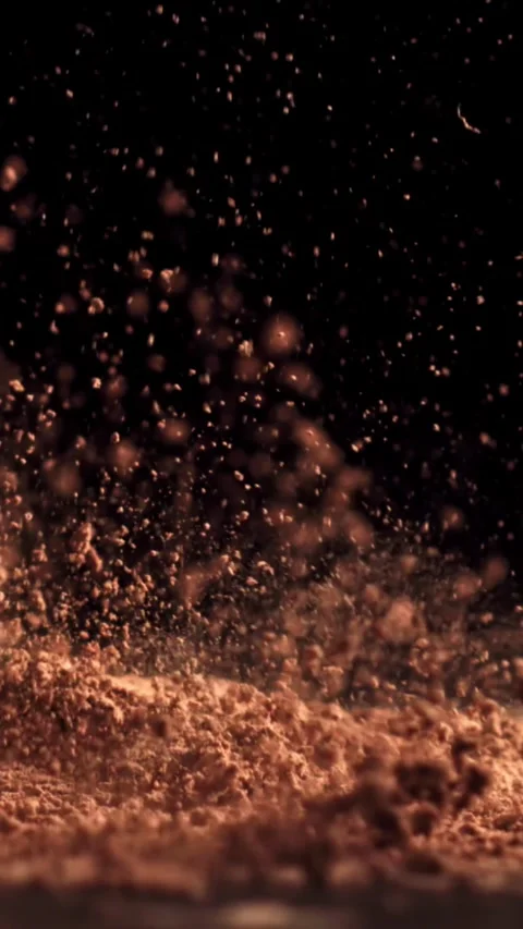Cocoa powder falls on the table. Filmed on a high-speed camera at 1000 fps Stock Footage 335380774
