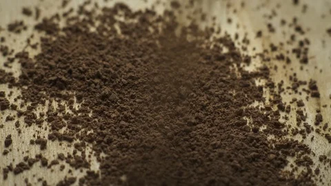 Cocoa powder granules fall on a rotating board Video stock 106500160