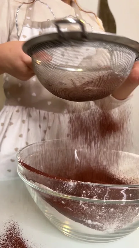 Cocoa powder is put into the pot Stock Footage 228725743