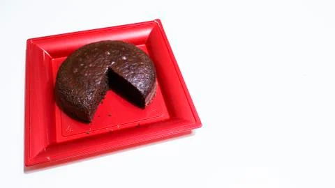 Cocoa sponge cake in a red tray Stock Photos