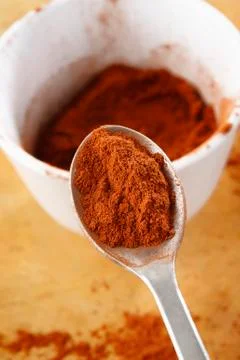 Cocoa on spoon Stock Photos