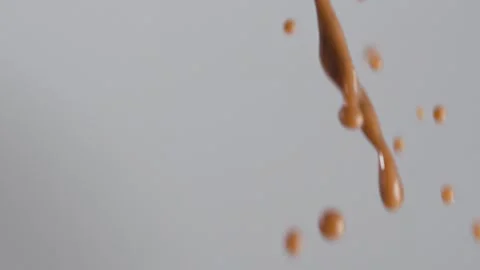 Cocoa spray close-up on grey background. Macro mode Stock Footage 144334480