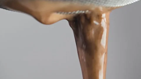 Cocoa spray close-up on grey background. Macro mode Stock Footage 144334498
