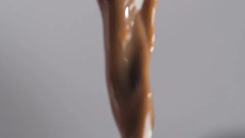 Cocoa spray close-up on grey background. Macro mode Stock Footage 144334503