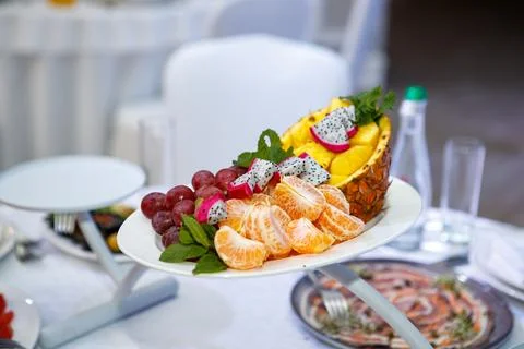 Coconut and fruit slice on the table Stock Photos