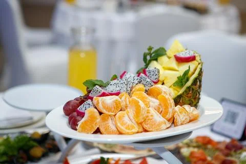 Coconut and fruit slice on the table Stock Photos