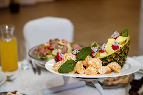 Coconut and fruit slice on the table Stock Photos