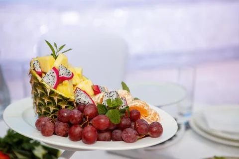 Coconut and fruit slice on the table Stock Photos