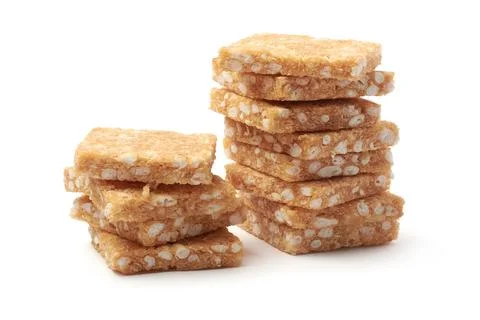 Coconut biscuits stacked on white background Stock Photos