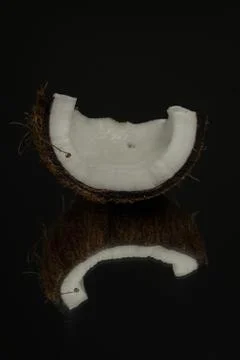 Coconut on a black background. Dark background Foto stock