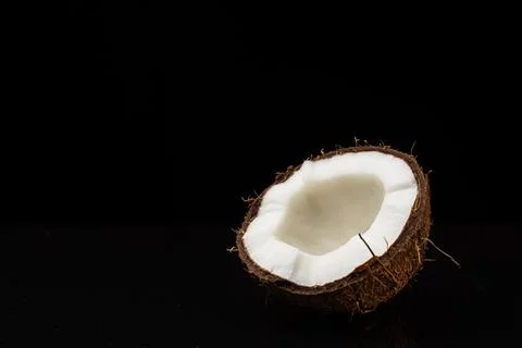 Coconut on a black background Stock Photos