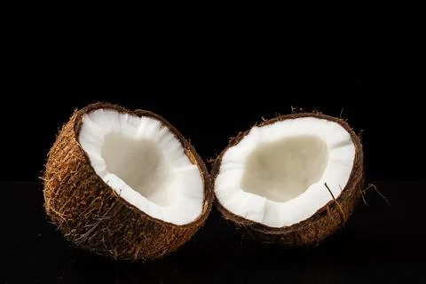 Coconut on a black background Stock Photos