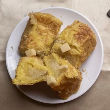 Coconut bread on white plate Stock Photos