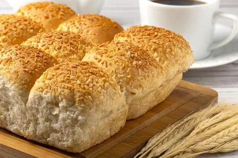 Coconut bread on the wooden table. Stock Photos