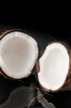 Coconut broken in half Stock Photos
