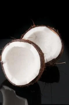 Coconut broken in half Stock Photos
