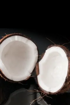 Coconut broken in half Stock Photos