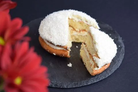 Coconut cake on a black background Stock Photos