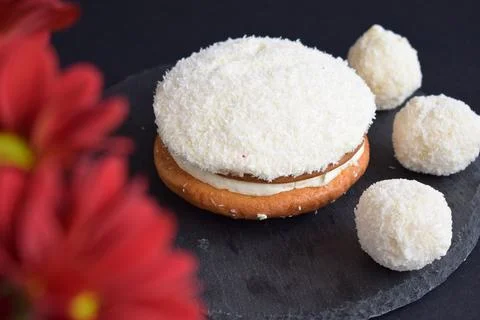 Coconut cake on a black background Stock Photos