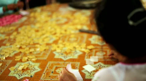 Coconut candy makers packing by hand Stock Footage 40436558