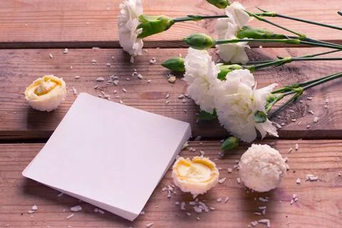 Coconut candy with nuts coconut candy with nuts and white flower. mock up ... Stock Photos
