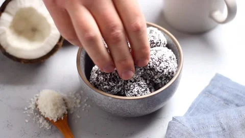 Coconut chocolate balls. Candy. Dessert. Vegetarian food. Stock Footage 213869618