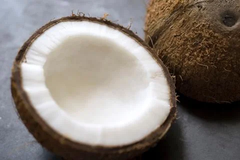 Coconut cut half inside white Stock Photos