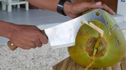 Coconut cutting closeup UHD Video stock 61474246