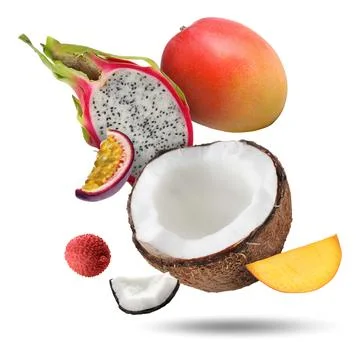 Coconut, dragonfruit, mango, lychee and maracuja falling on white backgroun.. Stock Photos