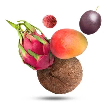 Coconut, dragonfruit, mango, lychee and maracuja falling on white backgroun.. Stock Photos