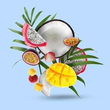 Coconut, dragonfruit, mango, lychees and maracuja in air on light blue back.. Stock Photos