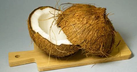 Coconut, exotic fruit, two halves of the fruit in the shell Foto stock
