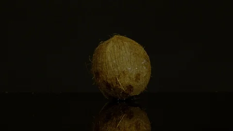 Coconut exploding, Ultra Slow Motion Video stock 86584356