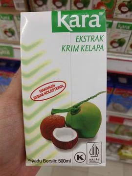 Coconut extract in a box Stock Photos