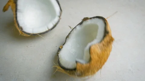 Coconut Falling and Splits in Half - Slow Motion Stock Footage 90153690