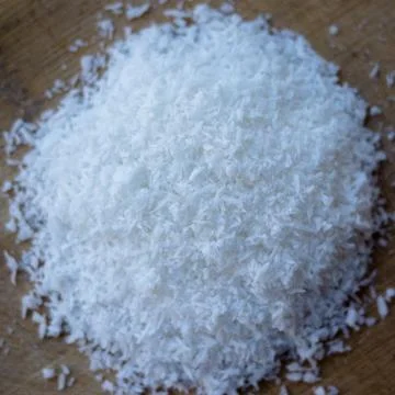 Coconut Flakes on brown table 写真素材