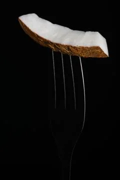 Coconut on a fork Stock-Fotos
