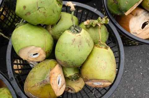 Coconut fruit at a basket Stock Photos