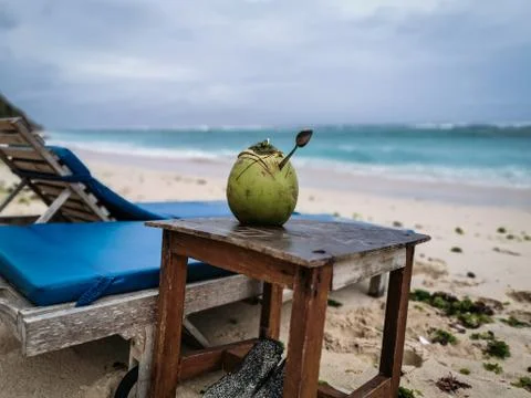 Coconut fruit on the table at the beach Stock Photos