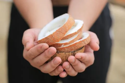 Coconut in the hands Stock Photos