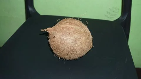 Coconut that has had its outer shell removed Stock Photos