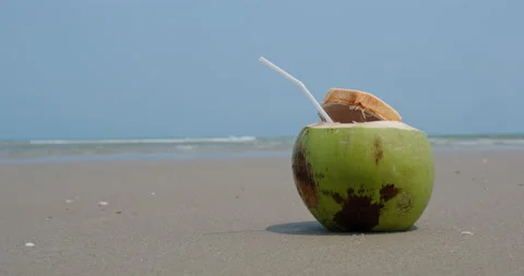 Coconut juice on the beach Stock Footage 132070877
