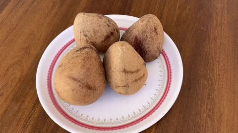 Coconut Kernel on Plate Display and Fresh Tropical Food Texture in 4K Stock Footage 323271187