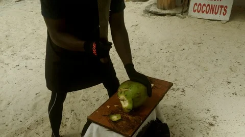 Coconut Man Chopped Coconut to get Water, Lucaya, Bahamas Stock Footage 111297677