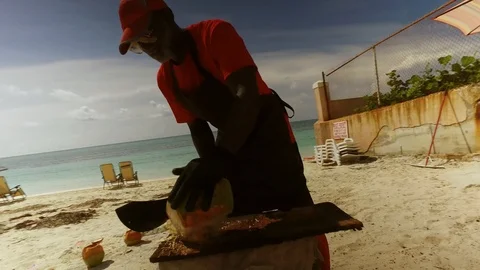 Coconut Man at Tropical Drink Bar Stand on Lucaya Beach, Grand Bahama Stock Footage 114183532