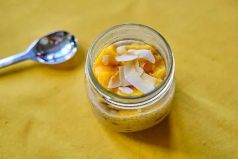 Coconut Mango Chia Seed Pudding in a Glass Jar Stock Photos