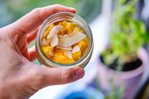 Coconut Mango Chia Seed Pudding in a Glass Jar Stock Photos