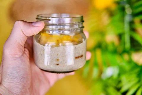 Coconut Mango Chia Seed Pudding in a Glass Jar Stock Photos